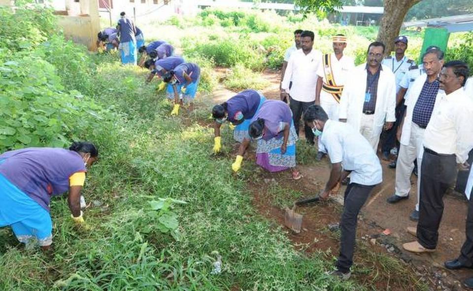 Sanitary staff attached to the Thanjavur Medical College and Hospital engaged in a mass cleaning exercise. 
