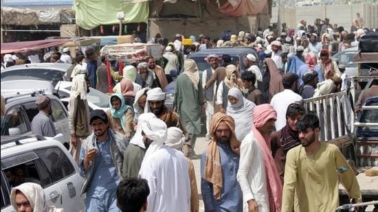 People arriving from Afghanistan gather at Friendship Gate crossing point in the Pakistan-Afghanistan border town of Chaman, Pakistan on August 27, 2021.