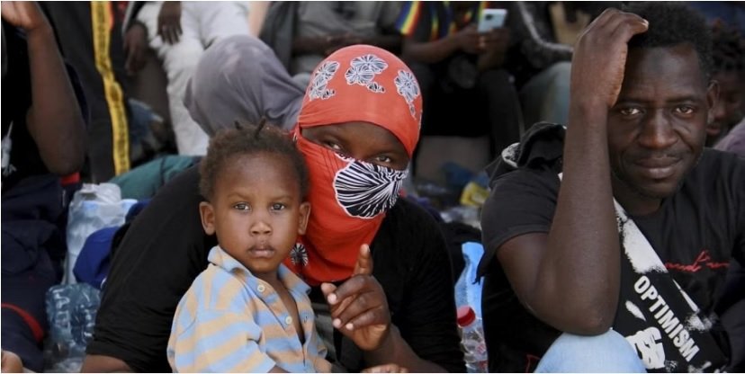 Under pressure, Tunisia takes back hundreds of migrants trapped in border zone with Libya